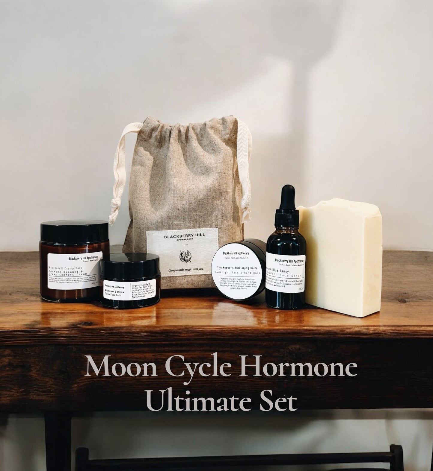 Moon Cycle Hormone Ultimate Set with various products on a wooden table.