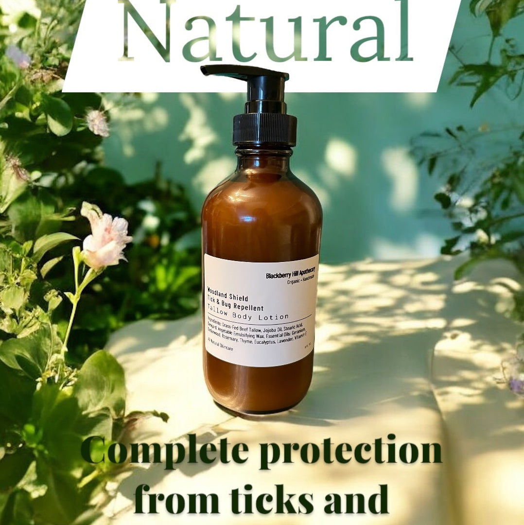 An amber glass pump bottle labeled 'Natural' with a black pump, placed outdoors on a light surface surrounded by green leaves and white flowers. Text overlays read 'Natural' and 'Complete protection from ticks and mosquitos.